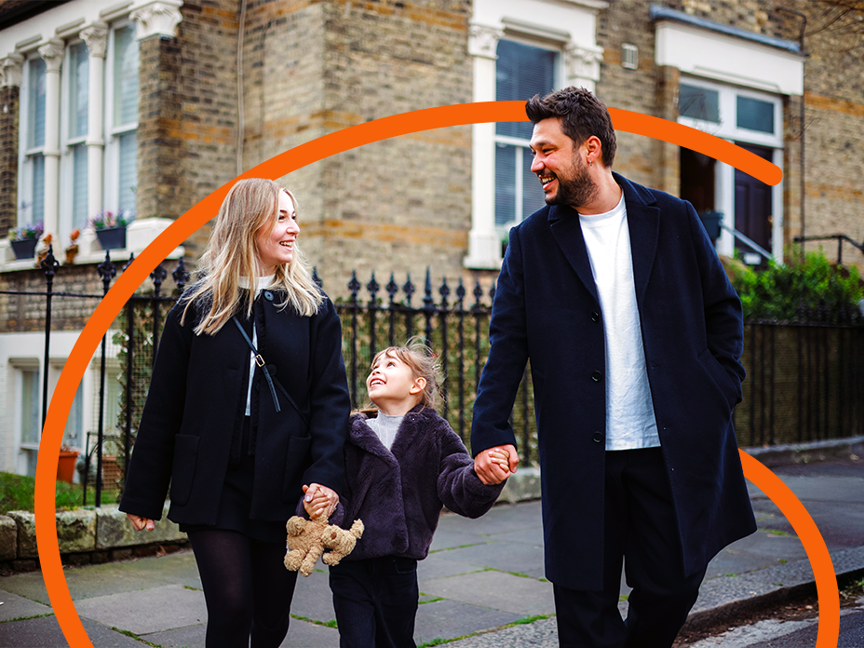 Family walking together on residential street - with expression