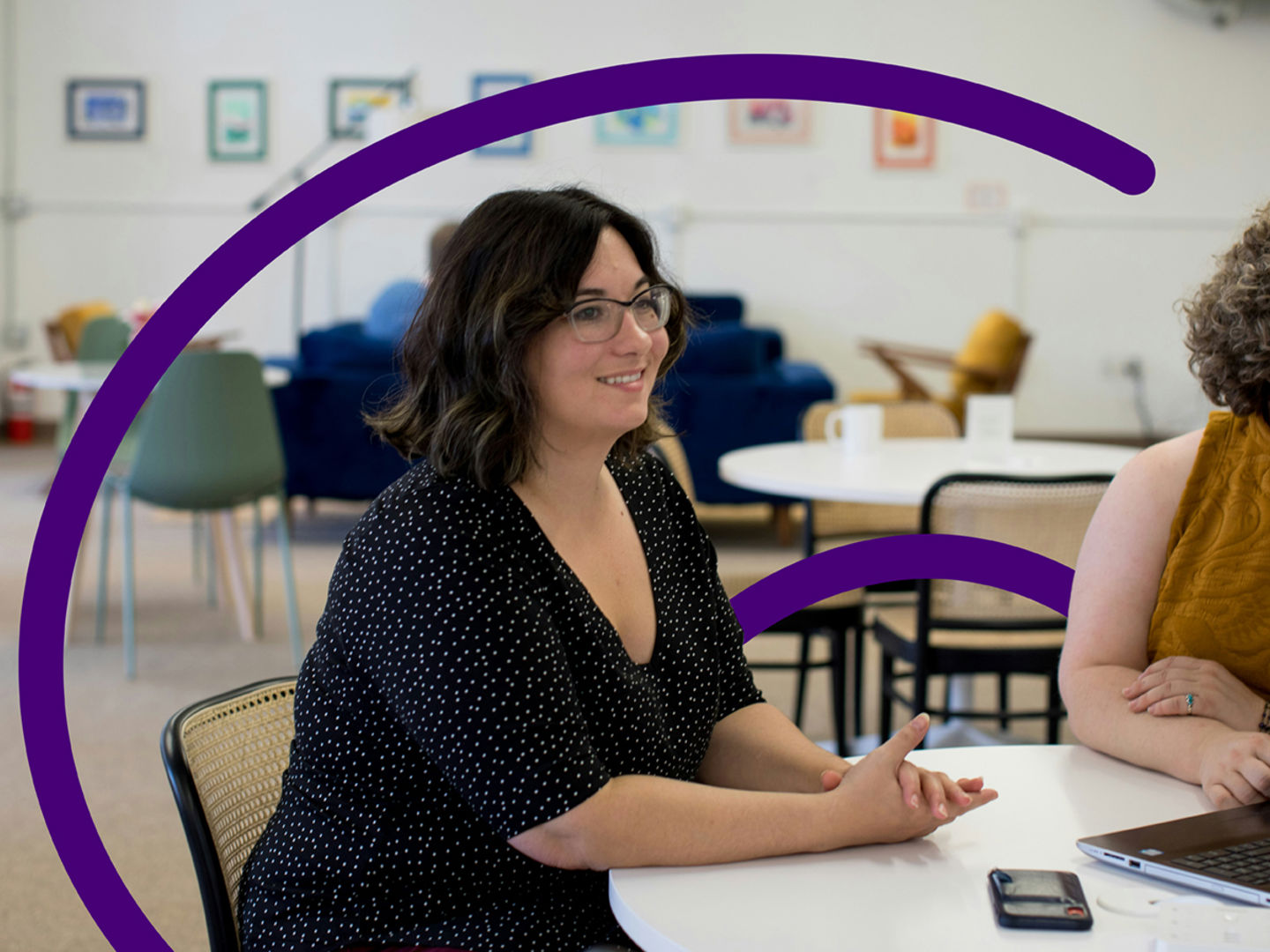 Two women working with a laptop