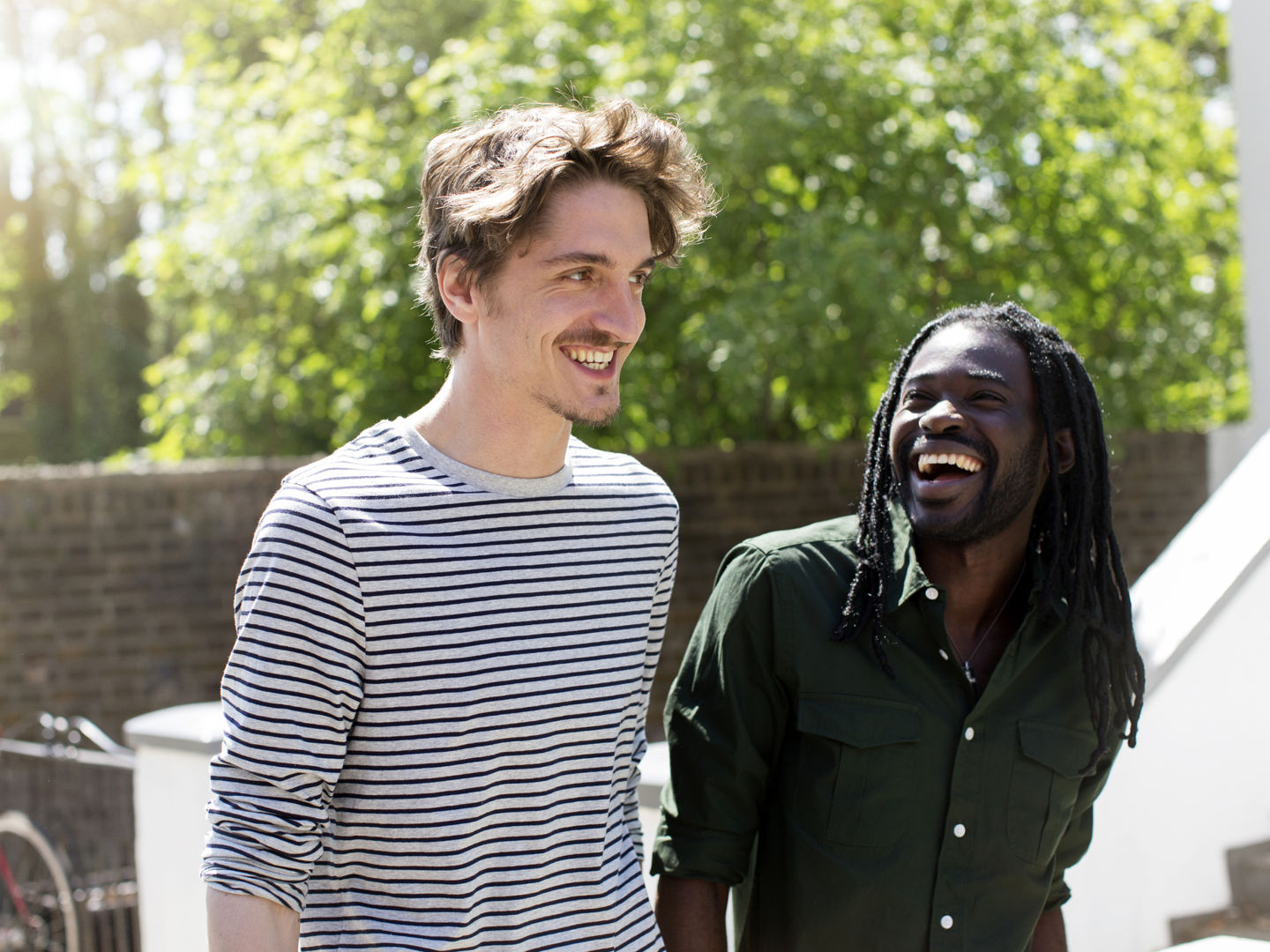 Two men outside walking together